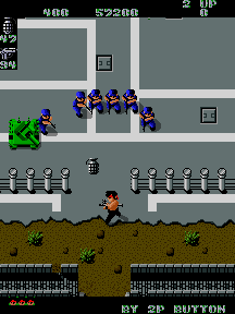 Ikari Warriors screenshot: the soldier advancing up a road toward a squad of enemy troops